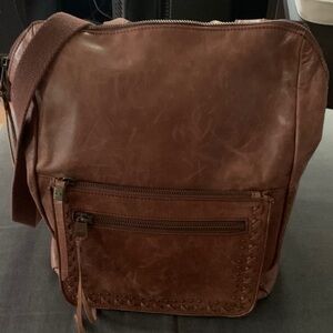 The Sak Brown Leather Unisex Backpack- strap can convert to crossbody